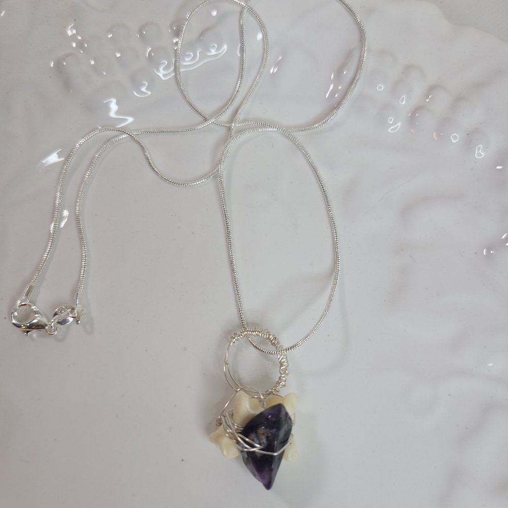 Handmade coyote bone and amethyst pendant and sterling silver plated necklace.